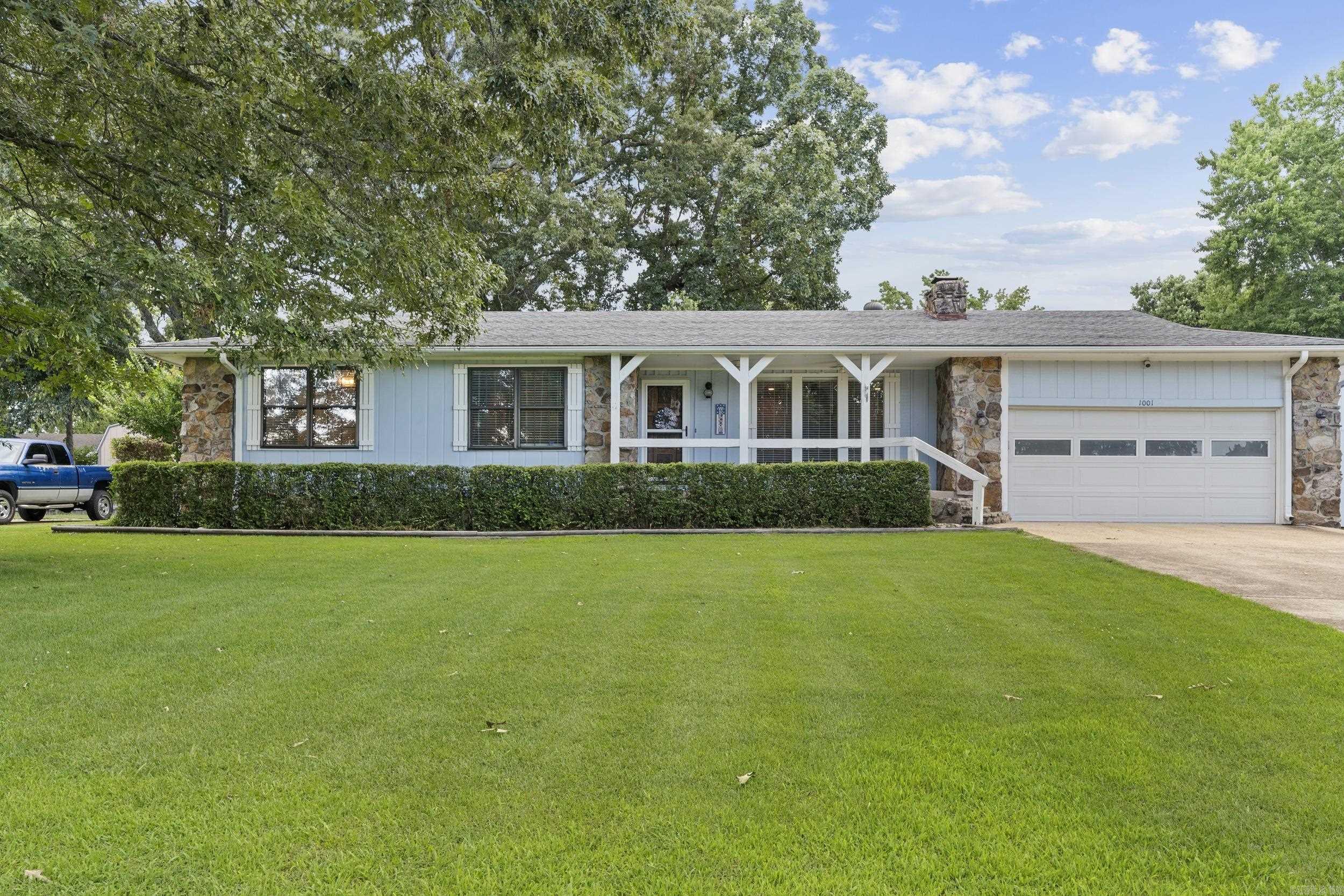 Discover this 3-bedroom, 2-bath home sitting on a large city lot right in town. The spacious living room features a striking rock fireplace, while the kitchen comes complete with all appliances. The master bedroom includes a built-in safe, and each bedroom offers plenty of comfort and space. Outside, you’ll find a covered back porch overlooking the yard with its own apple tree, perfect for relaxing or entertaining. Along with an attached 2-car garage, the property also includes a 35x20 shop, giving you ample room for projects, storage, or work needs. Conveniently located and move-in ready, this home offers the best of both space and location—schedule your showing today!