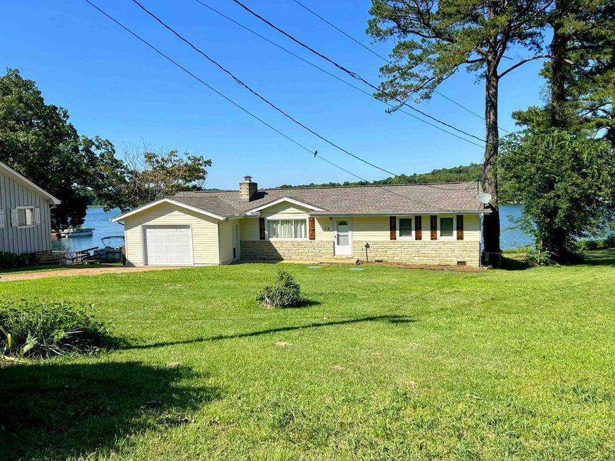 Beautiful 3 bdrm 2 bath home on Lake Sequoyah. Turn-key!! Sun porch has a great view of the lake. Sun porch has separate ductless h/a. Private boat dock (10x10) with over 125 feet of lakefront. Private beach! Just walk right into the lake from your own back yard! Prtl basement accessible from outside only. New Architectural Shingle roof 2022. New septic system 2023. Currently a VRBO w/great reviews! Fully furnished. 1616 sqft heat/cooled, 320 sqft garage, 240 sqft basement/work-shop, 369 sqft deck (partially covered) All elec except gas log fireplace & Tankless gas w/h. 1-Car Garage w/dr opener. Sm fenced-in area under deck. In a cul-da-sac, no thru-traffic. Come see this jewel before it's gone!