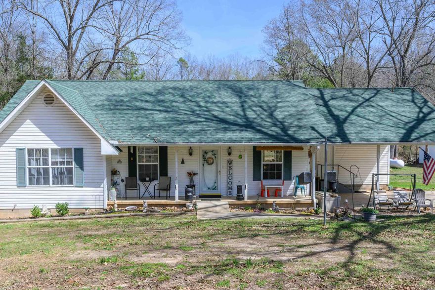 Discover country living on this 9.9-acre m/l hobby farm that is located less than 5 miles from town. Features include a chicken coop, 20 x 20barn with 15’ lean-to, raised garden beds, 8 x 10 storage shed, blackberry and elderberry patches, plus 2 peach trees and a fig tree. The 3-bedroom, 2 bath home offers wide doorways and hallway for easy access, ceiling fans, and a spacious utility room with sink and lots of built-in cabinets. Enjoy central heat and air plus an outdoor wood furnace, newer roof, and rear deck. Fenced backyard is perfect for pets or kids. Kitchen appliances convey. A 24 x 36 detached shop has vinyl siding and a metal roof and includes a garage door with opener, ample storage, and a finished H/C room ideal for an office, game room, or workshop. Private well with city water available.
