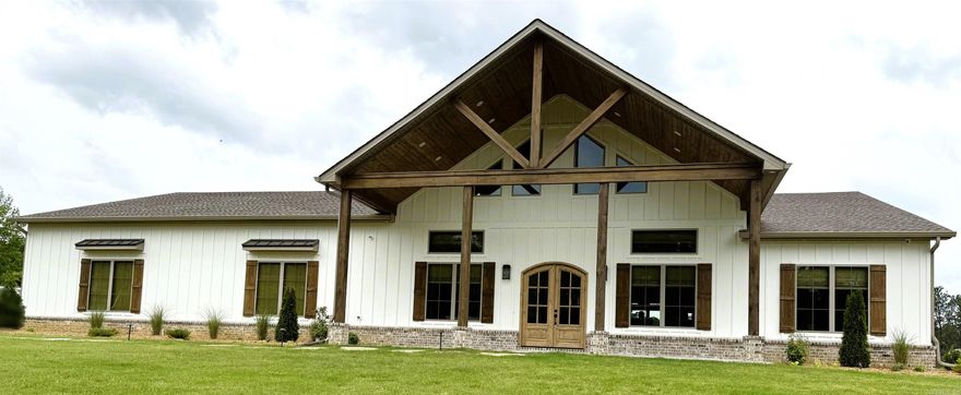 Welcome to your dream home! Nestled on 16 peaceful acres, you will experience a serene country setting completely fenced with an automatic gate opener. Offering abundant storage throughout, a whole-home generator, in-ground pool, pool house & a 30X40 shop, this property has it all. Natural light welcomes you into the open-concept living, dining, & kitchen areas, creating a warm & inviting environment. The living room boasts a soaring ceiling and a gas log fireplace. The primary bedroom features a vaulted ceiling and flows into the luxurious primary bath, complete w/ a walk-through double-head shower & a soaker tub. The kitchen is a chef's paradise w/ a 36" cooktop, stunning quartzite countertops, custom soft-close drawers & cabinets w/ inset lighting, a pellet ice maker, & an oversized island. A spacious pantry with abundant storage and counter space. This custom-built home is a true testament of thoughtful design complete with programmable exterior lighting for every holiday. See agents remarks.