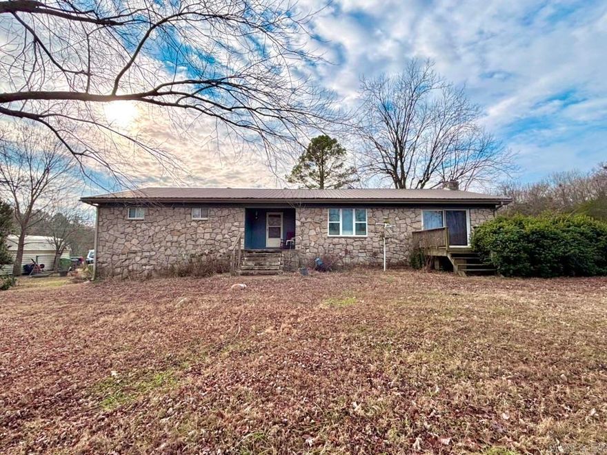 Nestled on 9.13 acres (±), this 2,292 sq ft farmhouse offers space, privacy, and versatility, set back off the highway for peaceful country living. The property features a durable metal roof, fenced and cross-fenced pasture ideal for cattle or other livestock, and a small stock pond at the front corner of the land. Enjoy outdoor living with a front deck and an in-ground pool in the backyard, perfect for relaxing or entertaining. A 30x40 barn/shop with electricity adds excellent functionality, while updates throughout the home blend modern comfort with farmhouse charm. Inside, the home includes a large kitchen, a spacious living and dining area with sliding French doors, a cozy fireplace, and central heat and air for year-round comfort. An additional room can serve as a bedroom, office, study, or sitting room. Adding even more value is a 440 sq ft guest apartment located beneath the 2-car attached carport, connected by a breezeway to the back entrance—ideal for guests, extended family, or rental potential! This property offers comfort, functionality, and room to grow in a peaceful country setting! Only a 7.3 mi drive to Pocahontas, a 3.6 mi drive to Imboden, & 45 mi to Jonesboro!