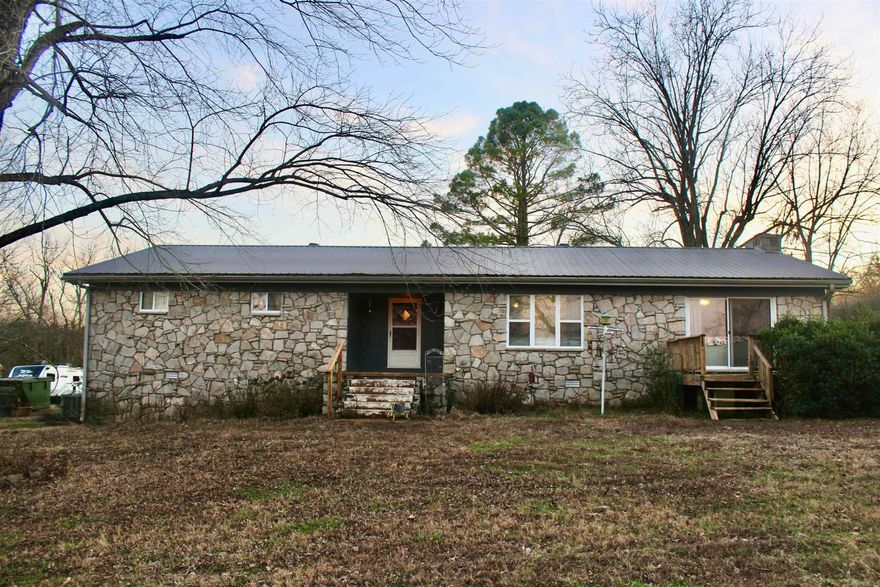 Nestled on 9.13 acres (±), this 2,292 sqft farmhouse offers space, privacy, and versatility, set back off the highway for peaceful country living! The property features a durable metal roof, fenced and cross-fenced pasture ideal for cattle or other livestock, and a small stock pond at the front corner of the land! Enjoy outdoor living with a front deck and an in-ground pool in the backyard, perfect for relaxing or entertaining. A 30x40 barn/shop with electricity adds excellent functionality, while updates throughout the home blend modern comfort with farmhouse charm. Inside, the home includes a large kitchen, a spacious living and dining area with sliding French doors, a cozy fireplace, and central heat and air for year-round comfort. An additional room can serve as a bedroom, office, study, or sitting room. The property also offers a 440 sq ft guest apartment beneath the 2-car attached carport, connected by a breezeway to the back entrance of the home—ideal for guests, extended family, or rental potential. Located just 7.3 miles to Pocahontas, 3.6 miles to Imboden, and 45 miles to Jonesboro.  **Lot line drawing is approximate and for reference only!**