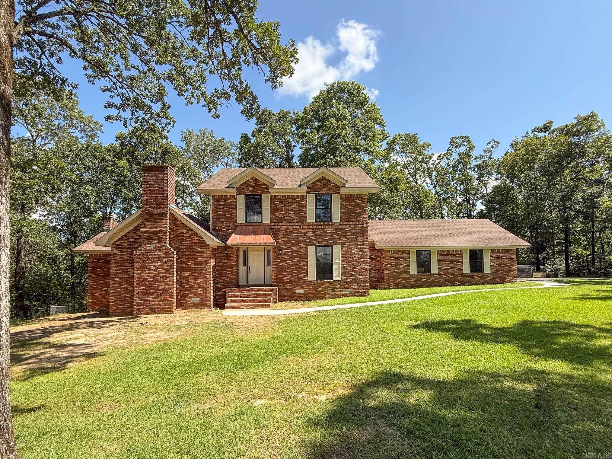 THis beautiful property truly has it all with an updated interior, an inground pool, a shop, and acreage making it ideal for both relaxation and entertainment. Whether you're preparing a family meal or hosting a gathering, this kitchen is designed to impress with an induction cooktop, a double oven with convection capabilities, upscale refrigerator, and beautiful granite countertops. With two generous living spaces, this home encourages socializing & comfort. The charming main living area boasts a brick wood-burning fireplace & real hardwood floors, while the secondary living area serves as a fantastic bonus area or playroom for the kids. Large formal dining room is excellent for hosting dinner parties while the breakfast room invites casual dining. The master bedroom is downstairs while the 2 guest bedrooms, each with their own bathrooms, are located upstairs. All bedrooms have new carpet. The shop includes electrical and water with a 3/4 bathroom. All of this on 3.77 beautiful acres! Newer roof and heat/air too!