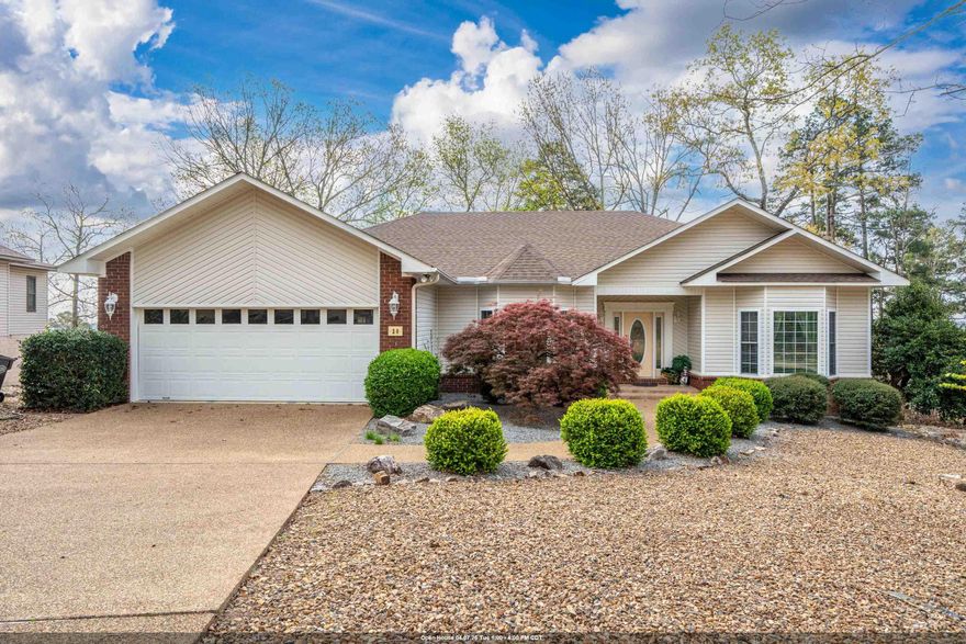 Enjoy winter mountain and lake views in this well-maintained home in Hot Springs Village, a premier golf and lake community near Lake Coronado. Centrally located for convenient access to golf courses, lakes, walking trails, fitness centers, and pickleball, this property is ideal for retirement living or a full-time residence. This 3-bedroom home features an open concept floor plan with volume ceilings and a dedicated office space just off the kitchen, offering convenience and flexibility for work or hobbies. The kitchen includes an extra-spacious pantry and flows seamlessly into the main living and dining areas, perfect for everyday living and entertaining. The oversized primary suite offers a comfortable sitting area, along with a spacious bath featuring a separate tub and shower and a generous closet. A full utility laundry room with cabinets, sink, and space for an additional refrigerator adds everyday practicality. Enjoy both covered and open back decks for relaxing and taking in seasonal mountain and lake views. A workshop space below the home provides excellent storage or hobby space. Level driveway and low-maintenance lot complete this inviting property.