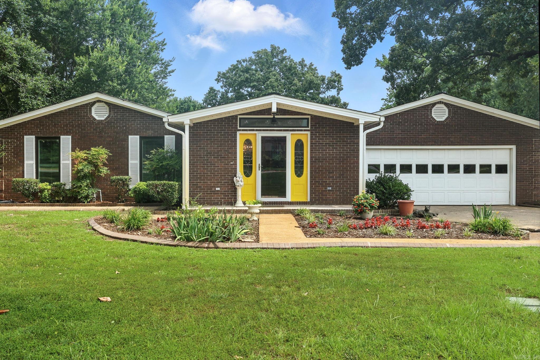 All-brick 3BR/2.5 BA home on 1.58 acres in West Little Rock with nearly 2,800 SF of living space. Features a fully updated 2019 kitchen with dual-fuel Jenn-Aire range, Delta touch faucet, farmhouse sink, 4 pantries, and mixer cabinet. Two fireplaces—one wood-burning (cast iron insert), one gas log with antique surround. Flooring includes luxury vinyl (2019), Bruce plank hardwood, and Shaw Berber carpet. Oversized garage with epoxy floor, garden sink, and built-in cabinets. Enjoy the 18x36 pool with diving board, Dolphin cleaner, brand new 2024 liner, and wraparound deck—perfect for entertaining. Two large outbuildings with power, concrete floors, and 2 RV hookups. Updates include 2025 crawl space encapsulation, new 4-ton HVAC with purifier, 2024 Pella casement windows, 2023 instant hot water heater. Deep well for garden and sprinkler system, full security alarm, sunroom with metal gazebo. Meticulously maintained and move-in ready!