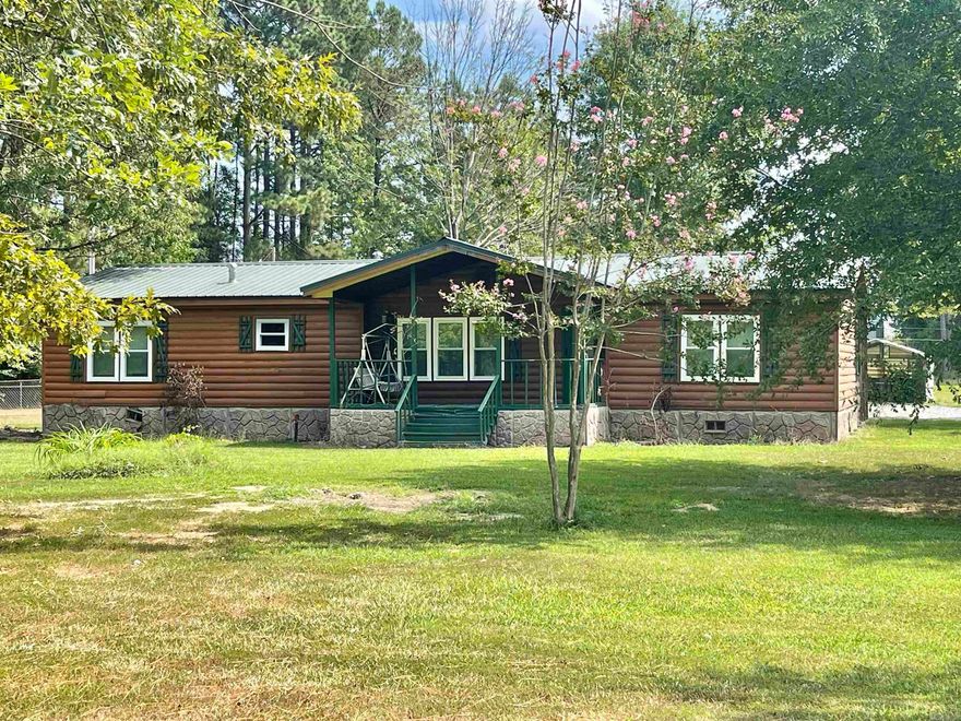 Don't miss this amazing and adorable 4 bedroom 2 bathroom mobile home sitting on 3.37 beautiful acres!!!!  This home is on a PERMANENT FOUNDATION!!!!  This amazing opportunity also comes with 2 storage buildings and a small metal carport.  New roof 2010, New HVAC 2022, New windows, septic tank, driveway, insulation, updated living room and paint 2023.  There is also a chain link fenced off area for your amazing fur babies to keep them in the yard as well.  This is conveniently located near Sheridan, Little Rock and Benton/Bryant areas.  If you are looking for land and need something that has potential for building your new home this one is for you!!!  Sold as is.