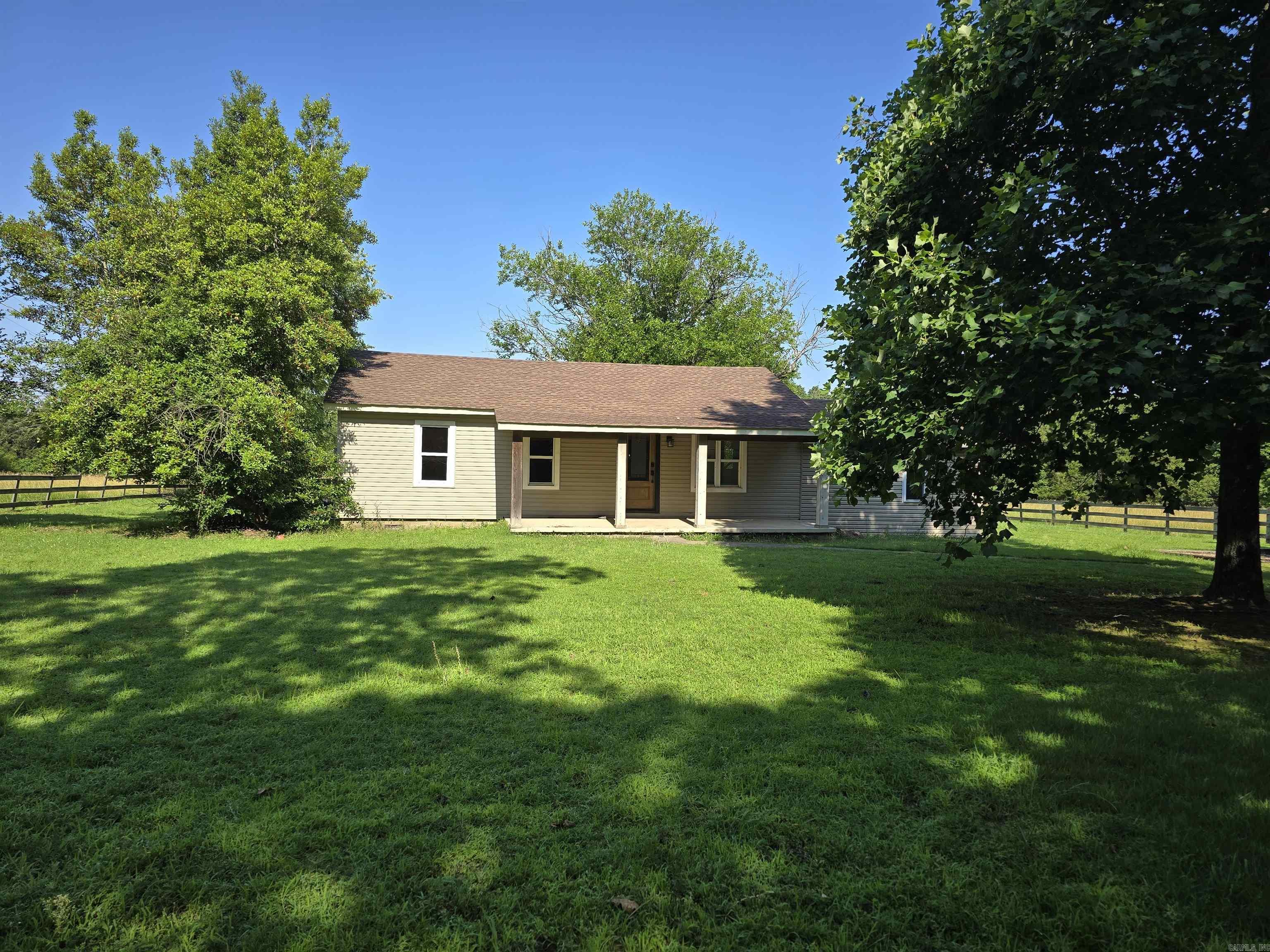 This cozy home is nestled on 10 areas offering both pastureland and lots of trees! The property features a 3bedroom 1 bath house with recent upgrades, a 20x30 barn, storm shelter and fenced pasture. The kitchen has granite countertops, a large farmhouse sink and tons of cabinet space. Enter the spacious laundry room through the beautiful sliding barn door that really brightens the space! There are both front and back covered porches perfect for relaxing and taking in the beauty of the property. Make your appointment today!
