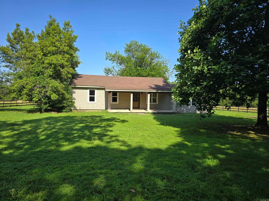 This cozy home is nestled on 10 areas offering both pastureland and lots of trees! The property features a 3bedroom 1 bath house with recent upgrades, a 20x30 barn, storm shelter and fenced pasture. The kitchen has granite countertops, a large farmhouse sink and tons of cabinet space. Enter the spacious laundry room through the beautiful sliding barn door that really brightens the space! There are both front and back covered porches perfect for relaxing and taking in the beauty of the property. Make your appointment today!