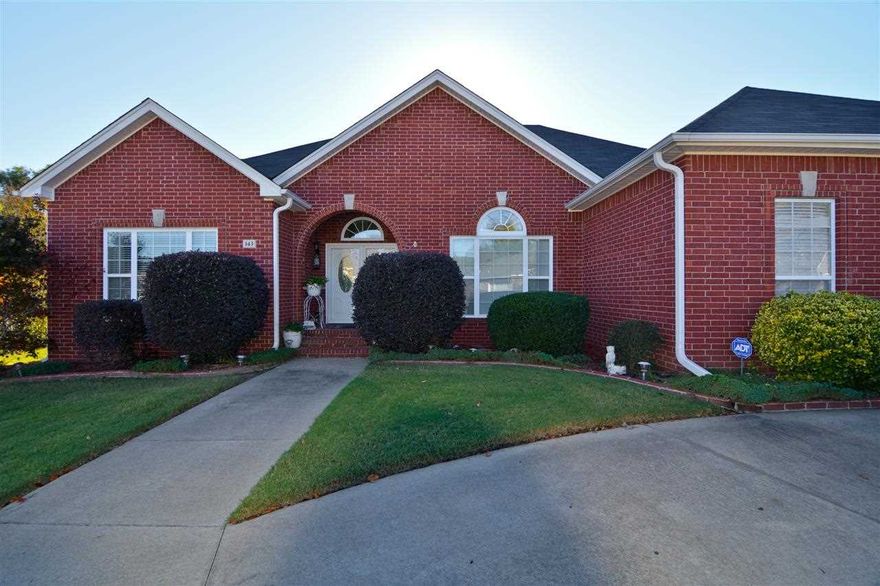 MUST SEE! 4 bedrooms and 2 baths with tons of extras. Split floor plan. Master has walk-in closet, whirlpool tub, separate shower. Kitchen has an island, garage has an additional stove/oven and sink, storage shed out back with extra landscaping and large deck!! Back yard backs up to a wooded area - private and peaceful! Front entrance has had additional brick work added, and there is a circle drive.