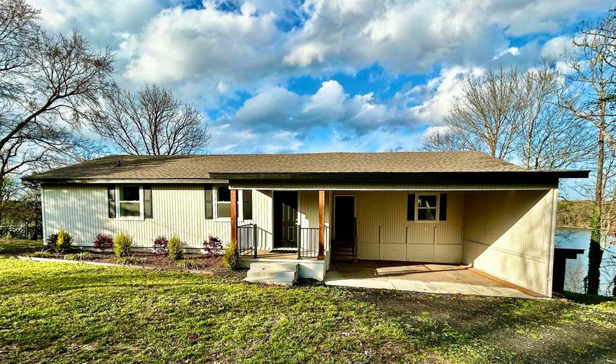 It's All About The View, The View, The View!! Step inside this totally renovated Lakefront Home, and start living your best life. This 1280 Sq' Home sits on .44 of a lakefront acre with one of the best views of Harris Brake Lake. This home has all new HVAC, Plumbing, Windows, Luxury LVP Flooring, Custom Cabinets and Granite Countertops ,Range, Dishwasher, Luxury Bathrooms and a Master Ensuite.  As you enter the home, the lake is waiting to greet you. The Large Kitchen has a magnificent Island, abundant cabinets, and laid out for the most discerning Chef in the house. Designed for entertaining, the open floor plan has easy access to the newly built large raised outdoor deck. Enjoy your coffee as you take in the magnificent lake view and mountains in the distance. The outdoor space is perfect to share with guests and boasts a Large lower landing, newly concreted, to add your gazebo or outdoor fireplace area. The large side yard would offer space for storage shed or additional garage to add to the house double carport.  There is abundant storage underneath with a walk-in crawl space, and a separate lower storage area in the carport . New Septic installed 2025.  Call for tour today!
