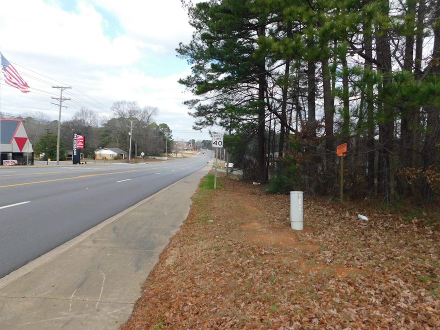 Great opportunity for development!!! This .93 acres +/- is located on one of the most highly visible and traveled streets in Bryant, one of Arkansas' fastest growing cities.  It is near many other national chains and would be great for many different uses.  Also very near I-30.  Partially wooded, utilities at the street!  Owner says bring all offers!