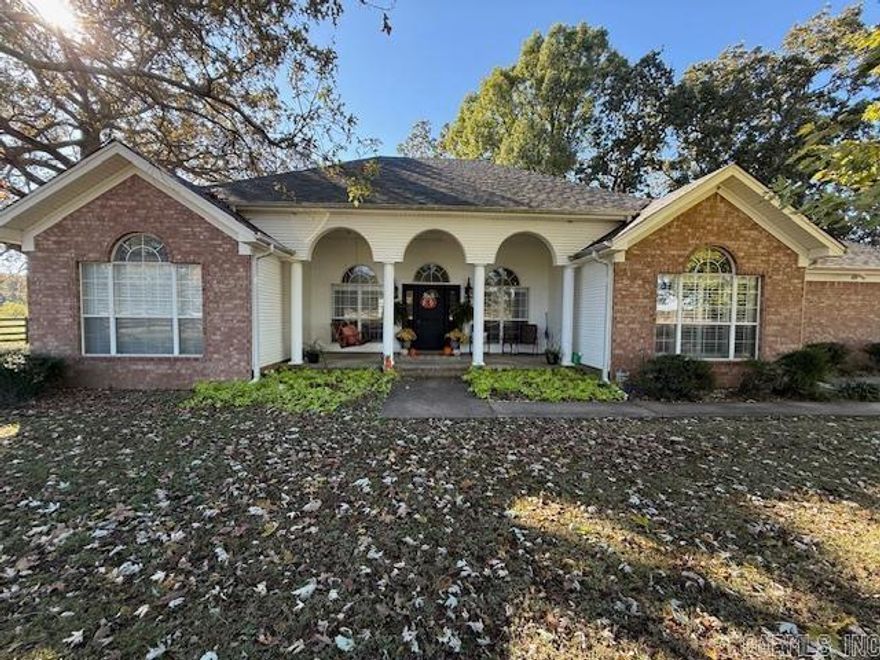 Experience the charm of country living on this stunning 3.35-acre property, ideally located on Hwy 236 North. Upon arrival, you'll be welcomed by a long driveway and a beautifully landscaped front yard with mature trees, setting the stage for this peaceful retreat. This late-century home features a spacious master bedroom with an ensuite bathroom, plus two additional bedrooms and one-and-a-half baths. The extra-large family room and open floor plan create a seamless flow throughout the living spaces. The expansive kitchen, with ample cabinetry and counter space, is perfect for cooking and gathering. Additional features include a generously sized office or TV room and a sunroom with abundant windows that flood the space with natural light.  For those who need extra workspace or storage, a massive 1,600 sq. ft. fully insulated metal shop is located just behind the home. Beyond the shop, you'll find a fenced small pasture, ideal for housing horses or cattle. This property offers the perfect blend of comfort, functionality, and rural elegance.