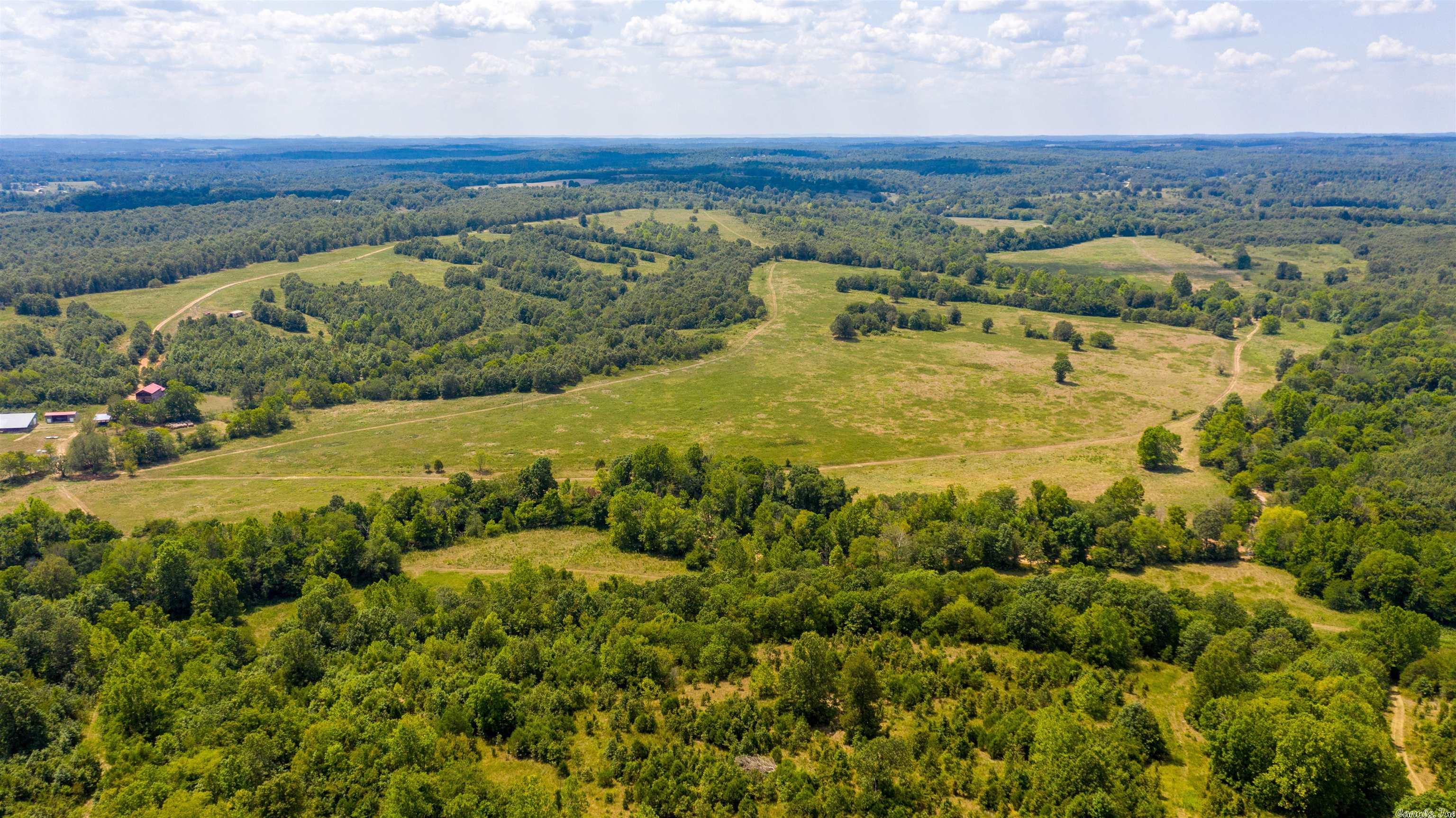 This is an incredible farm, hunting ground, home, barns, working (steel) coral covered, goat pen, all fenced and all with 1 mile of the Strawberry River running through it! This farm has hay fields, has ran over 350 cow/calf pairs and is excellent hunting! This is located just west of Glencoe, AR in Fulton County. This has Country View Road Access along with young road. You travel through a gate, down a drive where the house is secluded! Still close to Lakes, other Rivers, hospital and stores!