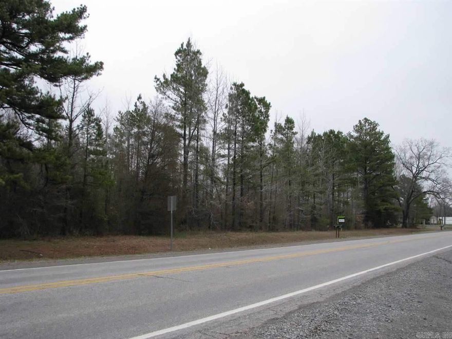 Excellent opportunity for development; commercial use in front, residential use in rear. Approximately 100' frontage on Hwy 367, in town, amid other local businesses. Property is mostly level & tree covered.  Some utilities available.  Owner will divide.