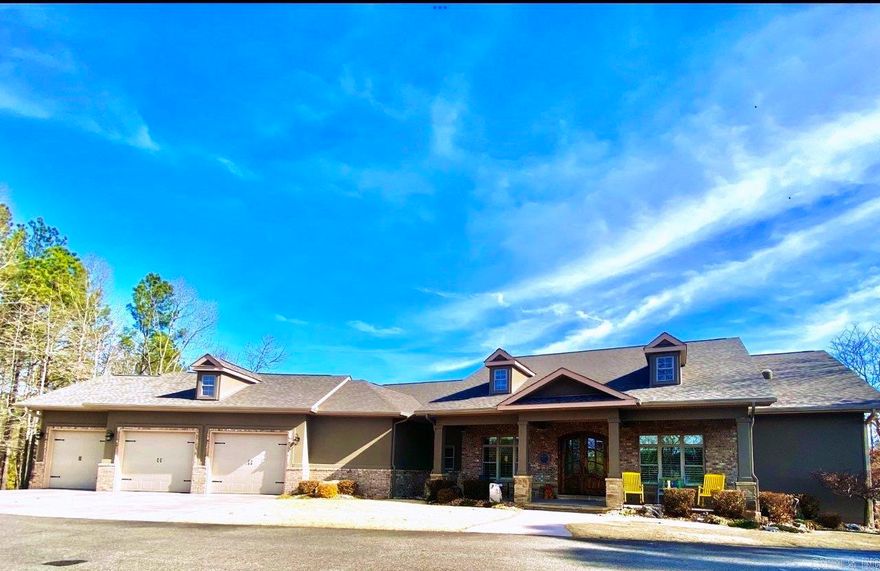 ONE OF THE BEST QUALITY BUILT LAKEFRONT (East Exp on Lakeside), ONE LEVEL, 3 CAR OVERSIZED INSULATED GARAGE with electric lift allowing more storage to floored attic. This elite custom construction by ELLISON Construction features so many upgraded features it would be impossible to list them all.  Top of the line on everything. Crown molding, beautiful wood floors, 3 Bedrooms, 2 1/2 Baths, Office, Great Room with beams, 10' Ceilings, Split Bedroom Plan, Formal Dining, Eat in Kitchen, Gas Range. Extra Large Pantry, granite counters, 2 Refrigerators and Washer/Dryer convey.  Heating system has 3 separate zones for convenience, pre-wired for portable generator. Mostly wood throughout, Carpet in guest bedrooms, heated tile in master bath, tile in guest baths and laundry rm. Beautiful seasonal lake views of open water, swim dock and boat ramp included. 2 Covered Decks, Lake fed sprinkler system and maintenance free professional landscaping. ROOF was replaced in 2023. Approximately 3137 Square Ft. h/c all on one level. Offering Price: $789,000.