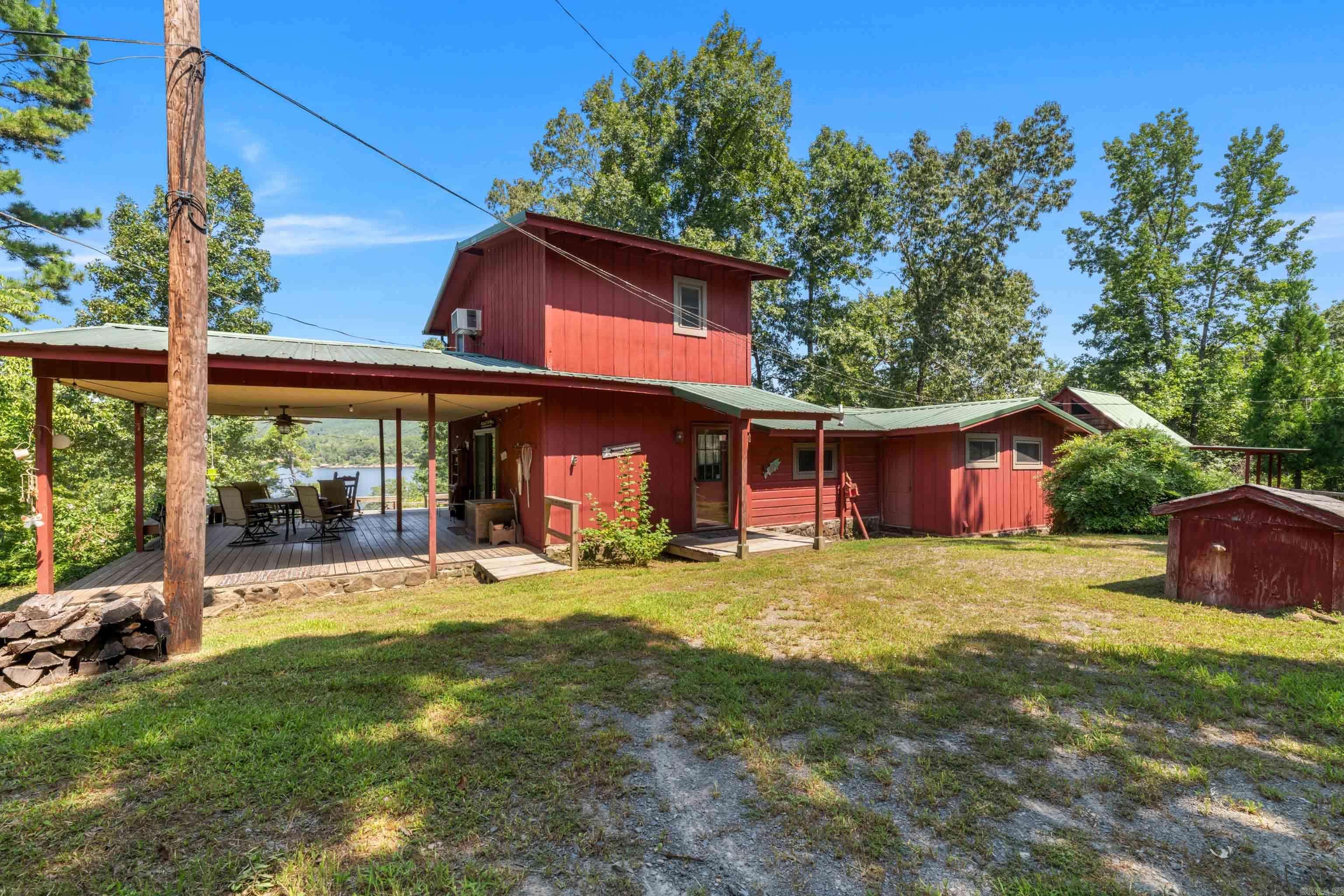 Fully furnished lakefront home on 1.20 acres at beautiful Greers Ferry Lake in Frontier Canyon with a Boat Dock! Next door to the boat launch, this rare gem offers everything you need for a relaxing lifestyle or an excellent investment opportunity. Enjoy breathtaking lake views from the expansive deck with your private boat dock (just needs a little TLC). The main home is move-in ready, featuring cozy, comfortable living spaces and plenty of room to entertain. Property features include: 1.20-acre lot with mature trees and privacy, large detached garage ā ideal for boat storage, workshop, or lake toy, fully furnished main home ā turn-key ready bonus rental cabin ā great for guests or additional income, private dock (needs some updates but functional), large deck with stunning lake views ā perfect for outdoor dining and relaxing, lakefront access with a short walk to the water. This is your chance to own a slice of lake life with the bonus of rental potential. Whether you're looking for a weekend getaway, a full-time residence, or an income-producing property, this one has it all. Schedule your private showing today ā lake life is calling! Agent Remarks