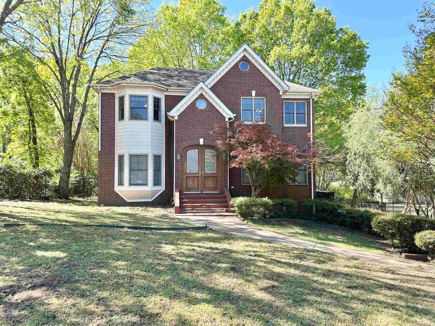Step into this spacious home featuring formal living and dining rooms, perfect for entertaining. The large kitchen offers a gas range, stainless steel appliances, and plenty of space for preparing meals. Just off the kitchen, you'll find a cozy breakfast room and den with a fireplace, creating the perfect gathering space. Upstairs, the primary suite features a private bath and walk-in closet. Two additional bedrooms are also located upstairs, each with walk-in closets, and they share a full bathroom. The basement level provides its own living area, an additional bedroom with a walk-in closet, and a full bath, making it ideal for guests, extended family, or extra privacy. This level also offers access to the garage, which includes a storage closet and a small room that would work well as a workshop. Outside, enjoy a tree-shaded backyard that offers added privacy and a peaceful setting.