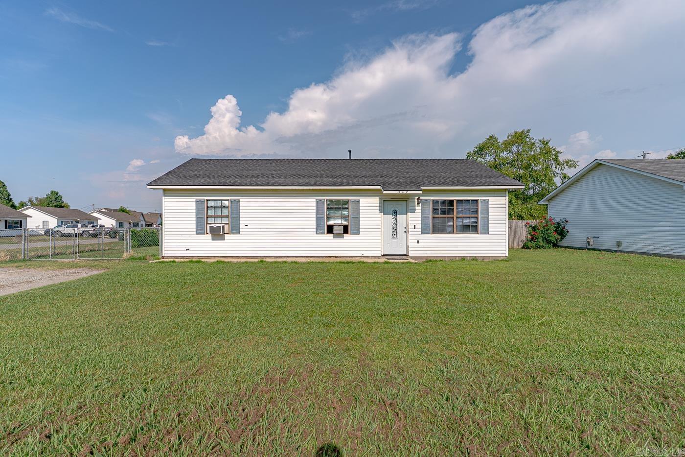 Welcome to market 329 Robin Street located in Bono, AR, and Westside School District! Sitting on a spacious corner lot, this home offers 3 bedrooms, 2 bathrooms, and a functional layout with the opportunity to customize the space. Step inside to the open concept living, kitchen, and dining area with plenty of cabinet storage. The layout includes a designated laundry nook, ceiling fans throughout, and window units for climate control. Enjoy a fenced backyard with patio space ideal for pets, play, or entertaining and enjoying the outdoors. This home is being sold as-is, offering a great opportunity to add value and make it your own. Call today to schedule your showing and make this house your home!