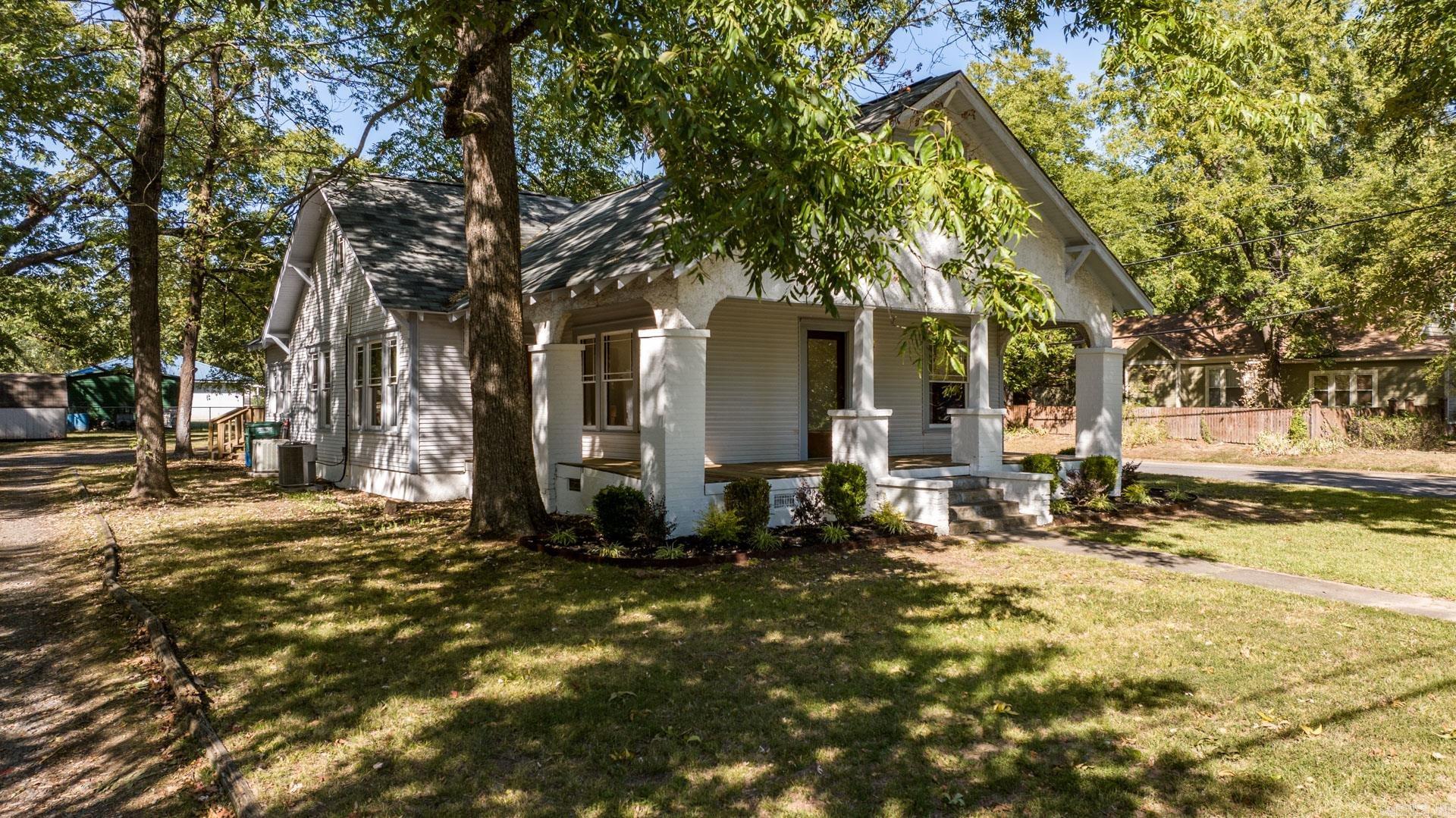 Step into your dream home in the heart of historic downtown Conway. This impeccably remodeled single-family home boasts three bedrooms, two full bathrooms and an office right off the primary suite. The home has undergone a full renovation which marries both contemporary functionality with the timeless appeal of original character. This unique property consists of two parcels on a large corner lot in which you can enjoy from your 32x12 back deck. Large windows throughout create a warm and inviting atmosphere from all the natural sunlight. The upstairs features a large secondary living room and reading nook that can be enjoyed by everyone. Don't miss this opportunity to make this remodeled gem your home. Schedule your tour today! AGENTS SEE REMARKS.