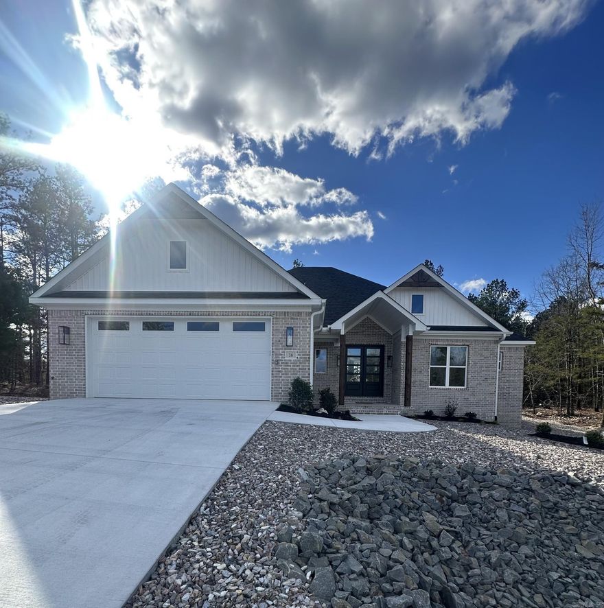Welcome to 16 Soldado Lane — a beautifully designed brick home perfectly positioned across the street from the prestigious Isabella Golf Course in Hot Springs Village. This modern, move-in-ready property offers timeless appeal and thoughtfully curated finishes throughout.  Inside, you’ll enjoy an inviting living area with a cozy fireplace, a chef-friendly kitchen featuring a gas stove, convection oven, microwave, and a spacious walk-in pantry. The convenient mudroom and laundry room add everyday functionality.  With today’s most desirable finishes, this home blends comfort and style effortlessly. Whether you’re relaxing indoors or taking in the peaceful surroundings, this property delivers the perfect combination of quality and location. Come experience easy, refined Village living.