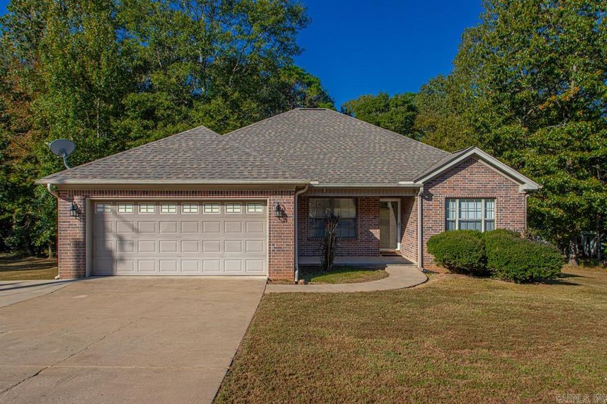 Discover this beautifully updated home in the desirable East End community, just 20 minutes from downtown Little Rock. This neighborhood is known for its spacious lots, and this property is no exception, offering approximately 1.3 acres of land for ultimate privacy and space. This three-bedroom, two-bathroom home features a popular split bedroom plan, providing a private and tranquil primary suite. The very spacious primary bedroom includes two closets and an enormous ensuite bathroom with a Jacuzzi tub, standalone shower, and separate double vanities with a dedicated vanity area. The home has been updated, featuring new LVP flooring, new paint, and modern fixtures. The kitchen boasts newer stainless steel appliances and a pantry, while the cozy fireplace has been converted to a gas log unit for convenience. Enjoy peace of mind with recent big-ticket updates, including a new roof (less than six years old), a new HVAC unit (2023), and new insulation in the attic. The home also has new toilets and window shades. Additional features include a large laundry room, a two-car garage, and a expansive back deck perfect for grilling and outdoor entertaining. Large storage building.