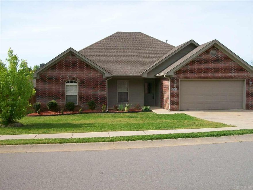 Well loved, one owner home.  Welcoming tile entry reveals an eye catching corner fireplace.  Great rm & master have tray ceilings.  All bedrms are great size.  Three walk in closets, tall vanities both baths. Spacious Kitchen with pull out drawers & stainless appliances.  Driveway has been widened for additional parking, deck was recently refinished + there is a concrete porch area that is under roof. Generous sized laundry room with nice cabinetry. 4th bedroom makes a nice office. BRYANT SCHOOL DISTRICT