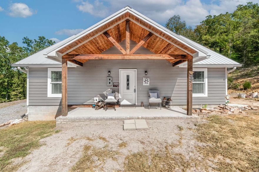 Looking for privacy without sacrificing convenience? This 2 bed, 1.5 bath modern farmhouse sits on 9.23 unrestricted and secluded acres just outside the Morrilton city limits with quick access to I-40—perfect for commuters or anyone craving space to roam.  Built in 2022, this home features an open kitchen and living area with vaulted ceilings and stained concrete floors for a sleek, low-maintenance finish. The primary suite offers a luxurious tiled walk-in shower, and both the refrigerator, washer, and dryer convey, making this home truly move-in ready. You’ll love the insulated, heated, and cooled 2-car garage, ideal for parking, a workshop, or hobby space. Other upgrades include a tankless water heater and durable metal roof.  With no restrictions, bring your animals, build a shop, or add another home—the possibilities are endless.