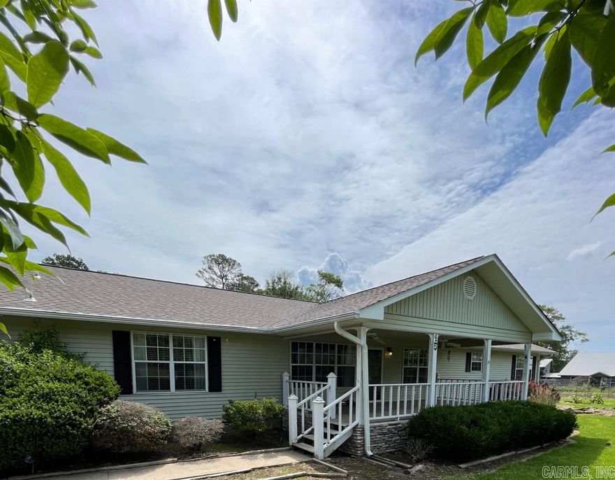 A must see beautiful 2200 sq. ft. home with additional 1400 sq. ft. shop on a little over 1 acre. Home boasts 3 nice sized bedrooms, 3 full bathrooms, two living areas, a bonus room, separate laundry room and dining room. A peek of Greers Ferry lake from one of the three covered porches.  Folks if storage is what you want, this house comes with an abundance! New roof in 2023 and water heater in 2020. Quiet rural lake neighborhood minutes away from Fairfield Bay that offers pools, bowling, and 100 miles of ATV trails. Make this your full time home or weekend lake house with plenty of room to store your toys! Don't miss this one, it's super nice! Schedule your appointment today.