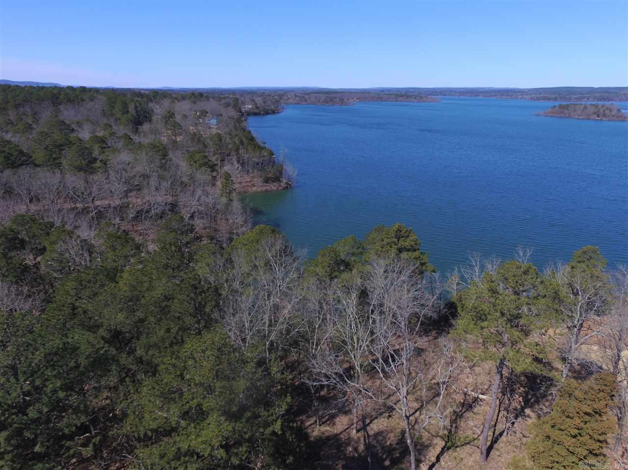 Premium lakefront lot on Greers Ferry Lake. Public sewer, all utilities and ready to build. Come see the stunning views from Heber Springs' newest gated lakefront subdivision! Taxes not yet determined.