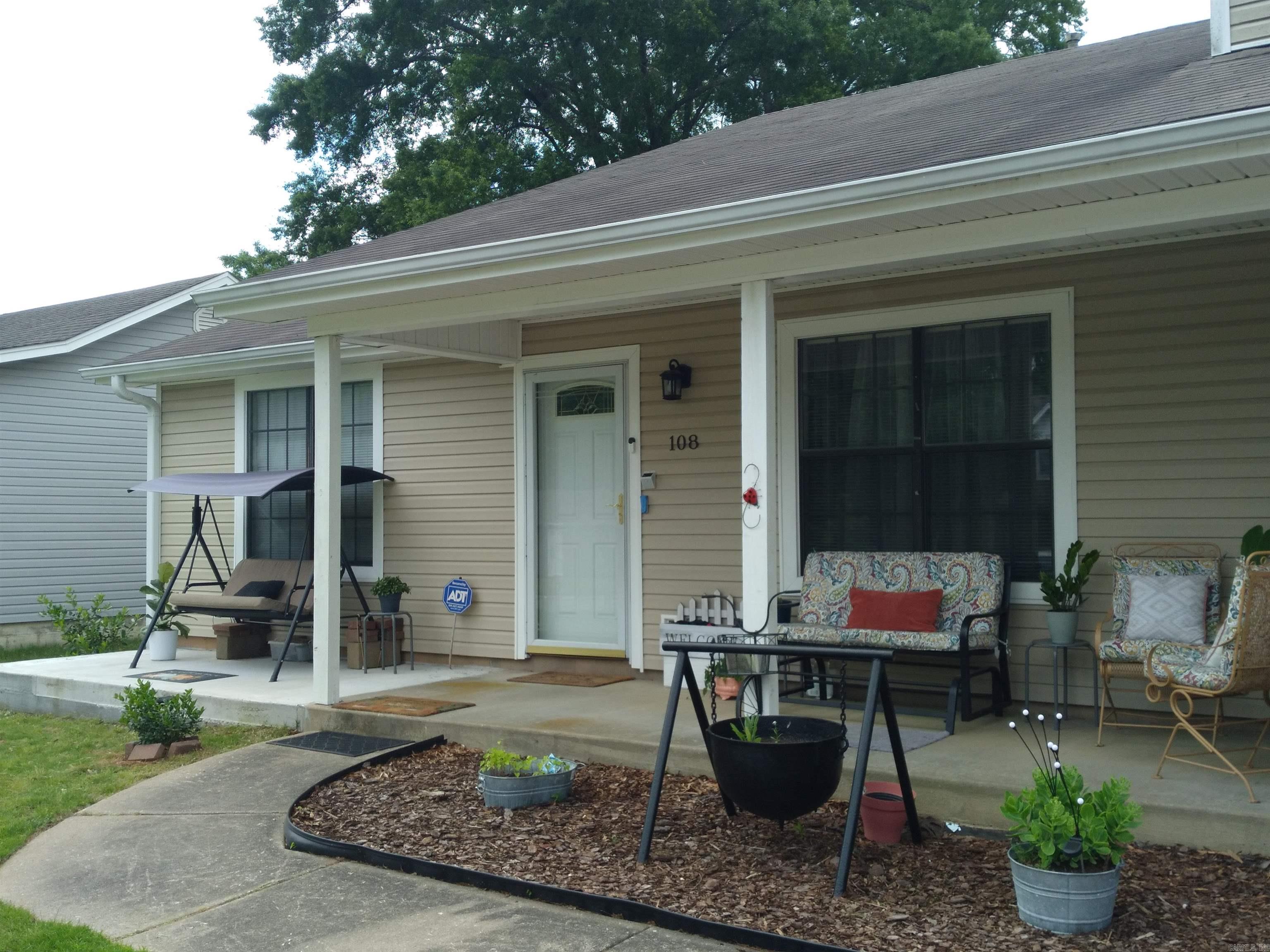 Come Home to this 3-bedroom, 2-bathroom dwelling that has easy access to the freeway. This home has many updates in the last few years. All new appliances in the kitchen, wood floors in the living areas, new carpet in the bedrooms, updated kitchen cabinets, fresh paint, garage door opener, Newer HVAC and Generator. Even the roof siding and gutters are in good condition. Relax on the front porch or enjoy the sunroom or separate patios in the backyard. Oh yes, you have plenty of space to store items in the storage building. The Refrigerator and mounted TV's will convey with the property.