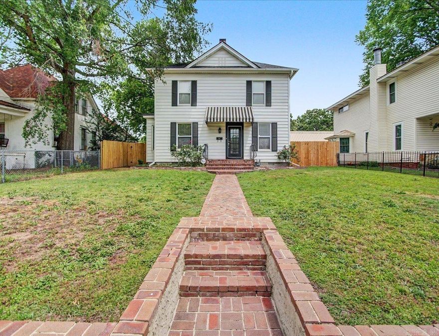 Charming furnished 1890 home with Short Term Rental license directly across from Oaklawn Racing and Casino and one block behind Rocky's Corner. Features 3 bedrooms, 2 baths, resurfaced hardwood floors, updated electric and plumbing, oversized rear parking lot, new roof (2023), new tankless water heater (2026), new washer/dryer (2025), new laundry room flooring, fresh exterior paint on home and detached garage (approx 2023), and new privacy fence (2025). Excellent investment or personal getaway in a prime Hot Springs location. Owner/Agent