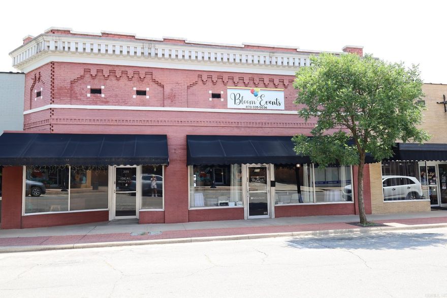 Welcome to 2408 sq ft of opportunity in the heart of historic downtown Paragould! This versatile commercial space is move-in ready and packed with recent updates, making it ideal for a restaurant, event venue, cafe, or retail concept. The building features a fully functioning kitchen complete with grease trap, new flooring and remodeled bathrooms. The freshly painted hallway with updated trim adds clean, modern touch, while the dedicated stage area makes it perfect for live music or performances. The roof has been recently sealed and repaired, and both heating and air systems are in good working condition, giving you peace of mind. With seating capacity of 60 (total capacity 91), this space offers flexibility and comfort for a variety of business types. Located on a high-traffic street in historic downtown, you'll benefit from excellent visibility, strong foot traffic, and a vibrant surrounding community. This is your chance to own a beautifully updated space in one of Paragould's most desirable areas!