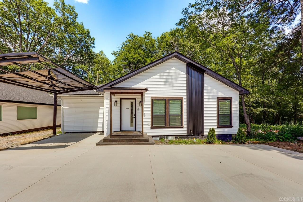 Experience the epitome of modern living in this fully renovated home, stripped down to its foundation and rebuilt with contemporary elegance. Enjoy the convenience of a tankless water heater, a walk-in shower, and a spacious master walk-in closet, providing a luxurious and comfortable lifestyle. Revel in the exquisite accents in the bathrooms, with beautiful details that add a touch of sophistication to your daily routine. Cozy up by the built-in fireplace, set against the backdrop of luxury vinyl flooring and beautiful epoxy countertops that elevate the home's aesthetic. With an abundance of storage, open-concept design, and approval for nightly rentals, this property is an unbeatable deal just minutes away from shopping and entertainment, offering a perfect blend of style and convenience. Home is currently a nightly rental. Has permit that is transferrable.