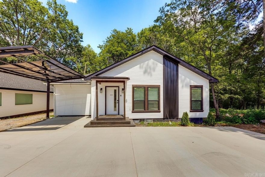 Experience the epitome of modern living in this fully renovated home, stripped down to its foundation and rebuilt with contemporary elegance. Enjoy the convenience of a tankless water heater, a walk-in shower, and a spacious master walk-in closet, providing a luxurious and comfortable lifestyle. Revel in the exquisite accents in the bathrooms, with beautiful details that add a touch of sophistication to your daily routine. Cozy up by the built-in fireplace, set against the backdrop of luxury vinyl flooring and beautiful epoxy countertops that elevate the home's aesthetic. With an abundance of storage, open-concept design, and approval for nightly rentals, this property is an unbeatable deal just minutes away from shopping and entertainment, offering a perfect blend of style and convenience. Home is currently a nightly rental. Has permit that is transferrable.