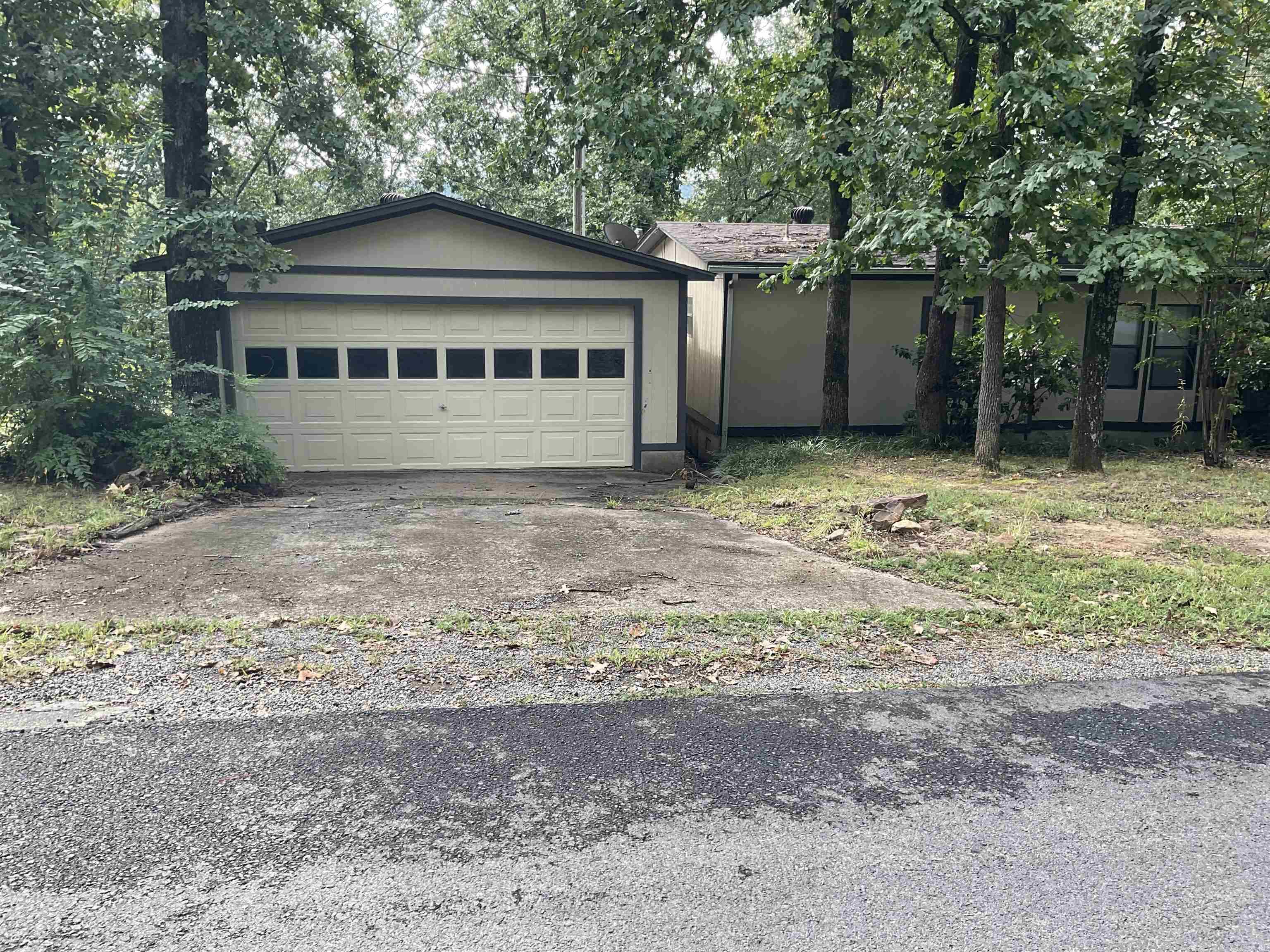 WOW UNBELIEVABLE !!! Home close to lake Seasonal view of lake Nice lake house need some work but very nice location ,quiet . 2 car garage and a 30X40 Shop Heated and cooled very well insulated . Storage building and RV parking area as well, has been surveyed 2 lots total excellent price and motivated seller . Sitting on just over an acre plenty of room to roam . This is a MUST SEE