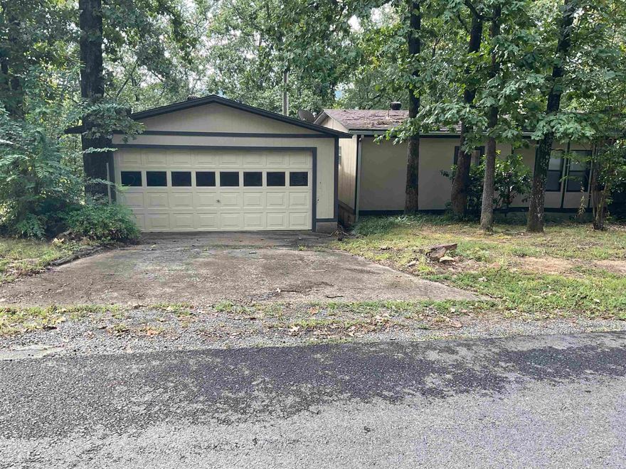 WOW UNBELIEVABLE !!! Home close to lake Seasonal view of lake Nice lake house need some work but very nice location ,quiet . 2 car garage and a 30X40 Shop Heated and cooled very well insulated . Storage building and RV parking area as well, has been surveyed 2 lots total excellent price and motivated seller . Sitting on just over an acre plenty of room to roam . This is a MUST SEE