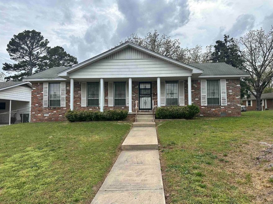 INVESTORS! Look no further! This 2 bedroom 2 bath home sits on a large corner lot and is located in a really nice older subdivision and would make a great Rental Property to add to your portfolio or a great Fixer Upper! It has a formal living room and den, nice kitchen space with plenty of cabinets, bar seating, and a Side x Side refrigerator. A large outside carport also offers additional storage space and the laundry room, equipped with a dryer. It's within walking distance to the neighborhood park and pool as well as fine dining and shopping.  This property won't last long! Schedule your showing today!!