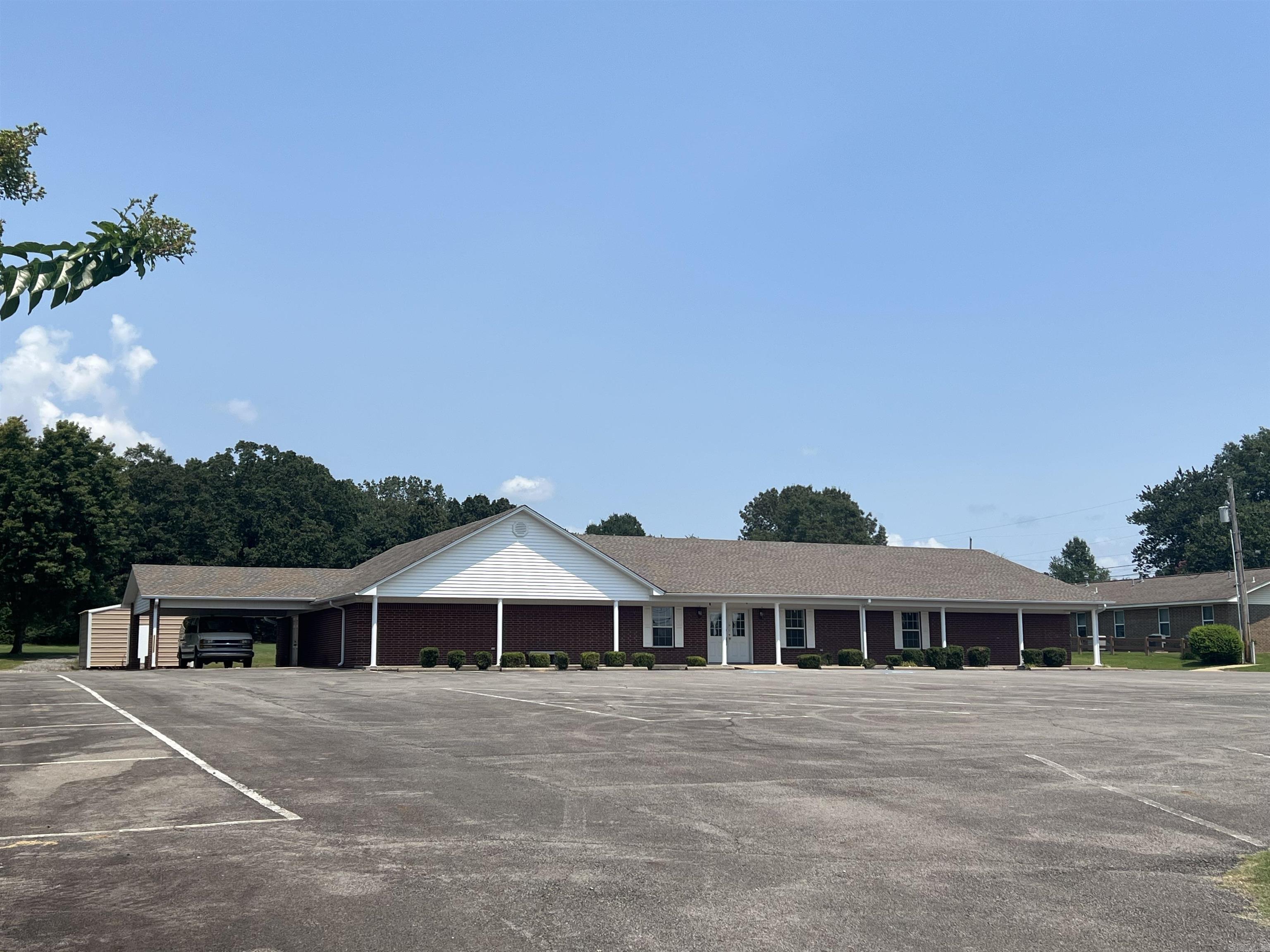 Great location! Most recently being used as a church with multiple rooms for offices or class rooms. Also, has 2 half baths, a kitchen and additional storage space. Large parking lot and with 2.65 +/- acres you have room to expand.