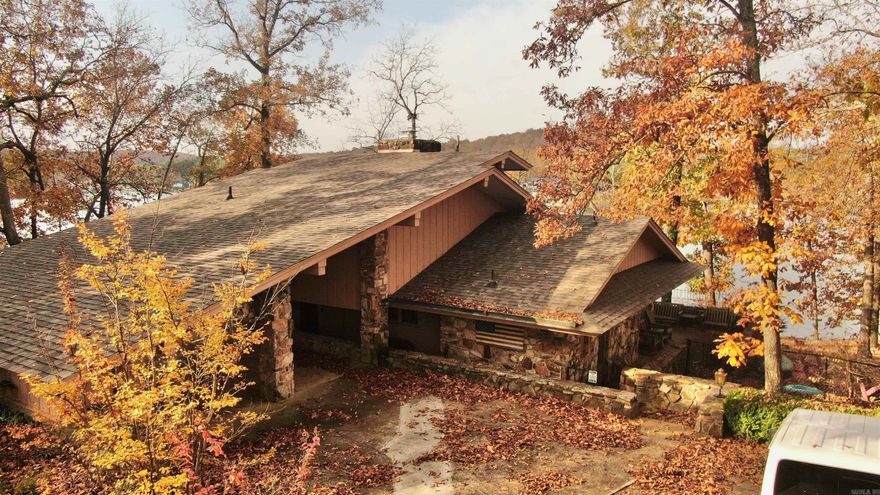 Wake up to wide-open Lake Thunderbird views in this beautiful home on nearly half an acre in Cherokee Village. Enjoy a wrap-around porch with gorgeous lake vistas — perfect for morning coffee, evening sunsets, or just relaxing by the water. This home also comes with a private covered boat dock, making it easy to enjoy everything the lake has to offer! Inside, it’s move-in ready with a new roof, new HVAC, new water softener, new kitchen appliances, and thoughtful cosmetic updates throughout. Outside, there’s plenty of space to enjoy the setting, and when you need a change of pace, restaurants, shopping, and other amenities are just minutes away. It’s a well-cared-for lake property with great updates, beautiful views, and a prime location — ready for its next owner to start enjoying life on the water!