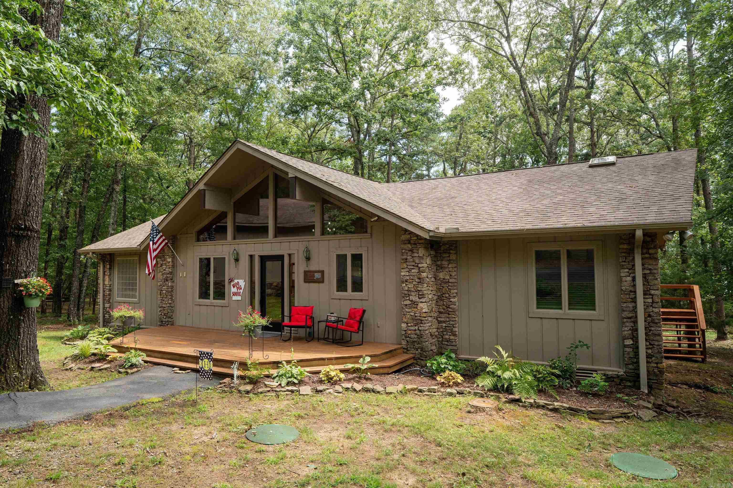 Nestled in the desirable Tannenbaum community on Greers Ferry Lake, this charming 3-bedroom, 2-bath home offers the perfect blend of comfort and convenience on 2 lots. Featuring a circle drive, detached garage, and a spacious deck ideal for entertaining, this property is designed for lake living. Inside, an open floor plan with a gorgeous remodeled kitchen, vaulted ceilings, skylights that fill the home with natural light, and walk-in shower. Whether you're looking for a smart VRBO investment, a peaceful weekend retreat, or your forever home, this property delivers the lifestyle youāve been dreaming of. Call for your private tour!