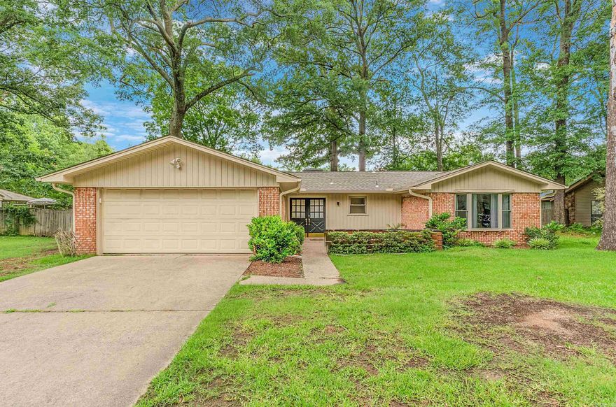 This beautifully updated 3-bedroom, 2-bath home offers a perfect blend of modern amenities and timeless charm. Step into the heart of the home, featuring a vaulted ceiling and a cozy brick fireplace, creating a warm and inviting atmosphere for family gatherings and relaxation. The fully updated kitchen is a chef's delight with custom cabinets, butcher block countertops, a farmhouse sink and amazing lighting. The kitchen also boasts a gas range, breakfast bar seating for four, and an adjacent dining area, perfect for entertaining. The spacious primary suite offers a private retreat with an en suite bathroom and a walk-in shower. Enjoy direct access to the back patio, ideal for morning coffee or evening relaxation. All three bedrooms come with walk-in closets providing ample storage. The new fully fenced backyard offers a private space for outdoor activities, gardening, or simply enjoying the fresh air.  A convenient 2-car garage provides additional storage and parking space. The new HVAC, roof, gutters and fence allow you to move in with peace of mind. Don’t miss the opportunity to make this beautiful house your new home! Schedule a viewing today!