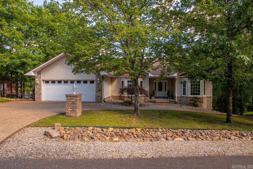 Enjoy golf course living in the heart of Hot Springs Village! This well-maintained home features a desirable split floor plan and spacious living areas with amazing natural light are designed for both comfort and entertaining. The oversized primary suite offers a large ensuite bath with dual vanities, tub, separate shower, walk-in-closet and pass-through hamper to the laundry room. The kitchen and main living spaces flow seamlessly to the back deck and beautiful views — perfect for morning coffee or relaxing evenings overlooking the 8th green of Balboa Golf Course. Additional highlights include a 2-car garage plus a walkout basement/crawl space with ample room for storage, workshop and your golf cart. Convenient location with easy access to two village gates and amenities. Agents see remarks.
