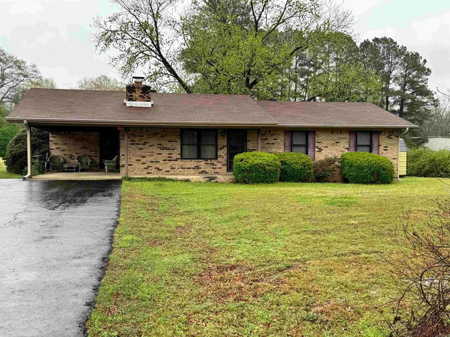 Great home on 2 acres of land off Akers road. This is a cute 70's home that is ready for your touch and updates.  Walk in to a larger living space with a wood burning fireplace insert that will warm the whole house.  The kitchen/dining combo area is a decent size that exits to an enclosed back porch that is heated and cooled and a great place for morning coffee.  HVAC unit is less than 5 years old.  There is a metal storage building that stays with the property and is a great place to store your yard materials.  Come see how to make this great property yours.