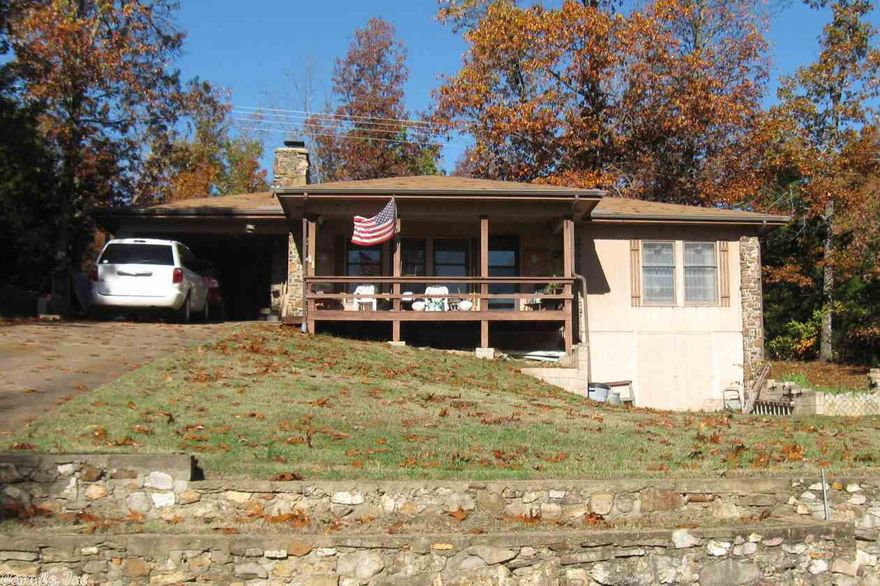 HOME IN THE WOODS! This cute home has no visible neighbors and has wonderful distant views from covered front porch. Also cart distance to south golf course and near lake. Home includes all appliances and some furniture too.