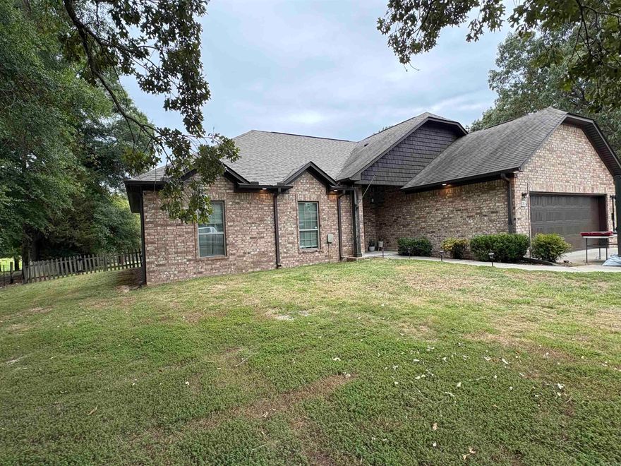 Nice open floor plan with corner fireplace in the great room. Custom Cabinets with granite throughout. Breakfast bar & walk in pantry in the kitchen. Master has a walk in shower and whirlpool tub. NEW back door and New waterproof LVP flooring being installed in the formal areas. Tile in wet areas and carpet in the bedrooms. Large laundry room. New dishwasher and garage door 8-25-25. Nice covered back patio with an extended oversize deck, safe room. Fully fenced backyard all sitting on a 1/2 acre lot. Extended driveway for extra parking in the front. Less than 10 minutes to Conway. Agents see remarks & docs.