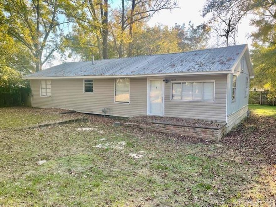 This three-bedroom home offers one and a half bathrooms, a roomy den complete with a fireplace, and a backyard fenced for privacy and fun. Sure, it needs some updates and foundation tweaks to the crawl space and subflooring, but the exterior has a metal roof and vinyl siding on the front. With a sprinkle of creativity and a dash of elbow grease, this house could become your family home for years to come!