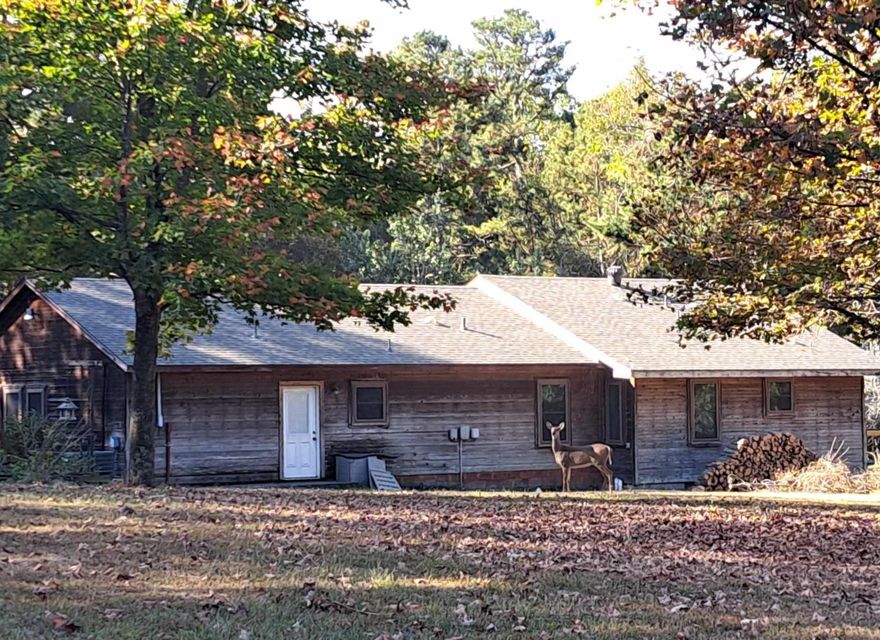 Great country feel with handy highway access. This 3br/2ba home with detached enclosed garage was built with quality in mind. Home has 2x6 walls, NEW ROOF 8-24, solid wood cabinets, and newer vinyl windows. Inside you find an abundance of open floor space, wonderful storage throughout, and a spacious master suite with private living area. Plenty of bonus space and options for living layout. The french doors and many windows bring the outdoors in, plenty of deck and paved porch areas to enjoy this peaceful setting. Property has a spacious feel with a flat yard backing up to woods and mature shade trees. The 24x24 insulated garage/shop building with dual covered patios provides great additional room under roof. Rural setting yet accessible to amenities and the Hwy 412 corridor. So many nice features complete this wonderful place to call home!