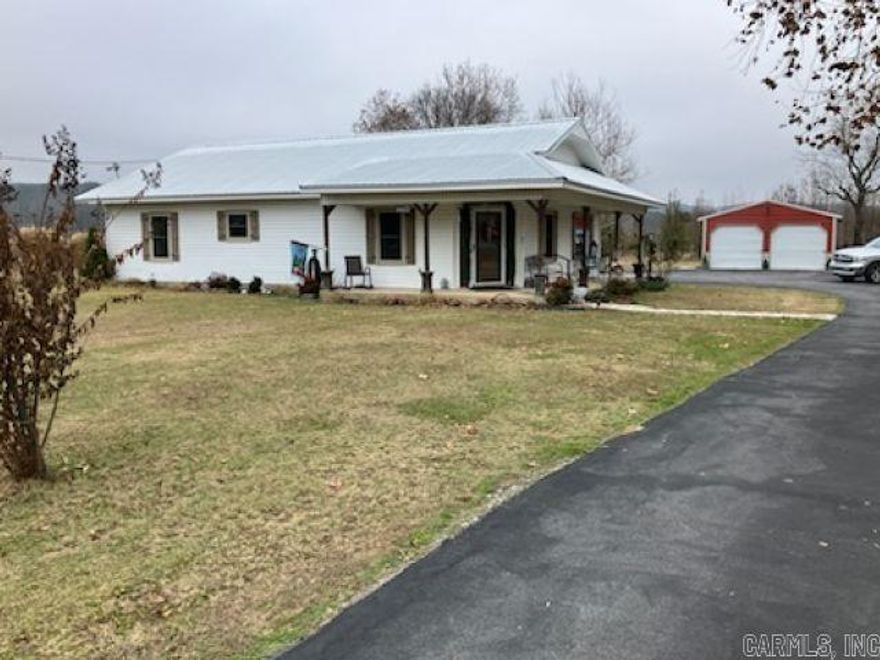 This charming home sits on 2.38 acres on Hwy 36 outside Searcy city limits. It was remodeled in 2021 to include new windows, flooring, paint throughout, and both bathrooms and the kitchen were redone. The whole home features some amazing craftmanship in the details.  The home features 2 baths, 3 bedrooms (the 3rd on is being used as a den), crown molding in common areas, hard surface countertops, a large pantry with a prep area, an oversized 2 car garage, large asphalt parking area, metal roof(2017), gas wall heater for back up heat, asphalt driveway, a large shop, a spacious storage building, a pavilion for entertaining, a great storm cellar with a sidewalk leading from the garage, some beautiful views and so much more. This home is priced to sell, so come see it today!!!