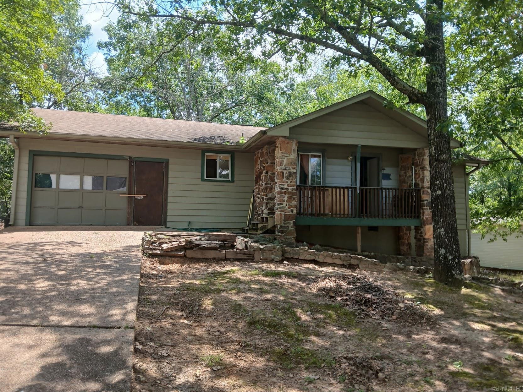 Looking for a getaway spot or your next investment? This 2 bed, 1 bath fixer upper is full of opportunityājust waiting for your personal touch. Located just minutes from Greers Ferry Lake, this home would make a perfect lake retreat, weekend rental, or full-time residence. Enjoy easy access to everything the area has to offerāboating at Fairfield Bay Marina, hiking trails, campgrounds, and even golfing nearby. Whether you're into outdoor adventure or peaceful lake days, this location checks all the boxes. With a little vision and elbow grease, you can transform this property into your dream escape. Don't miss your chance to own a slice of lake life at an affordable price! Agents, see remarks. Acreage was estimated using lot dimensions, encourage interested buyers to do their own measuring.