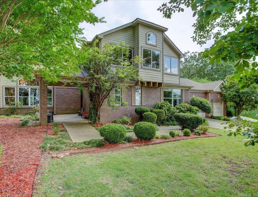 This exquisite gated Stonegate Shores 4 bedroom, 2.5 bathroom residence offers serene lake and mountain views ,Step inside this light and airy contemporary home to discover an open floor plan designed for modern living with soaring ceilings and 3 fireplaces. The spacious living area is bathed in natural light, creating a warm and inviting atmosphere. The gourmet kitchen, equipped with top-of-the-line stainless steel appliances, sleek Corian countertops, and a large island, is perfect for both everyday meals and entertaining guests. Retreat to the luxurious master suite, which features a private courtyard, a beautiful ensuite bath with double-sided fireplace, beautiful shower with waterfall showerhead and body spray nozzles Jetted tub & walk-in closet. The additional three bedrooms are generously sized and share a well-appointed full bathroom, providing ample space for family or guests .Outside, the covered deck with television and expansive patio  are perfect for al fresco dining or simply relaxing while taking in the breathtaking views of the lake and mountains. The meticulously landscaped yard offers both beauty and privacy, enhancing the outdoor living experience.